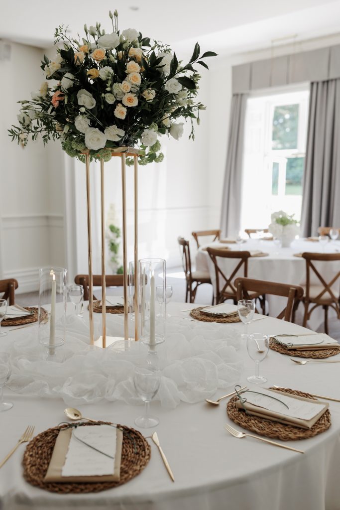 tall fresh flower centrepiece on gold stand