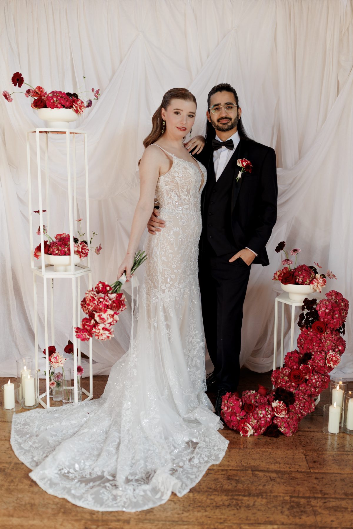 bride and groom surrounded by fresh flowers