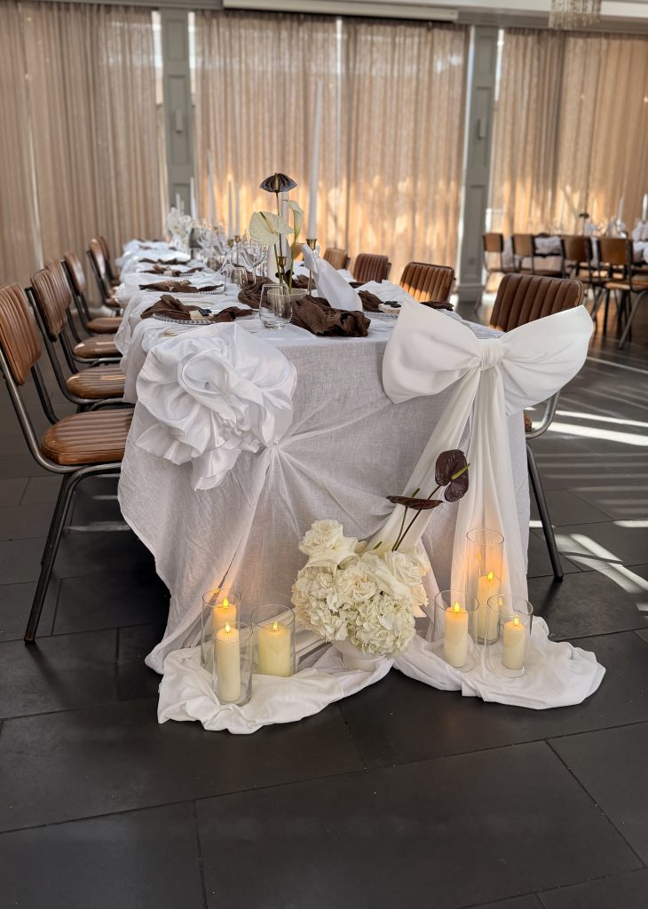 fabric installation on table with bows and roses
