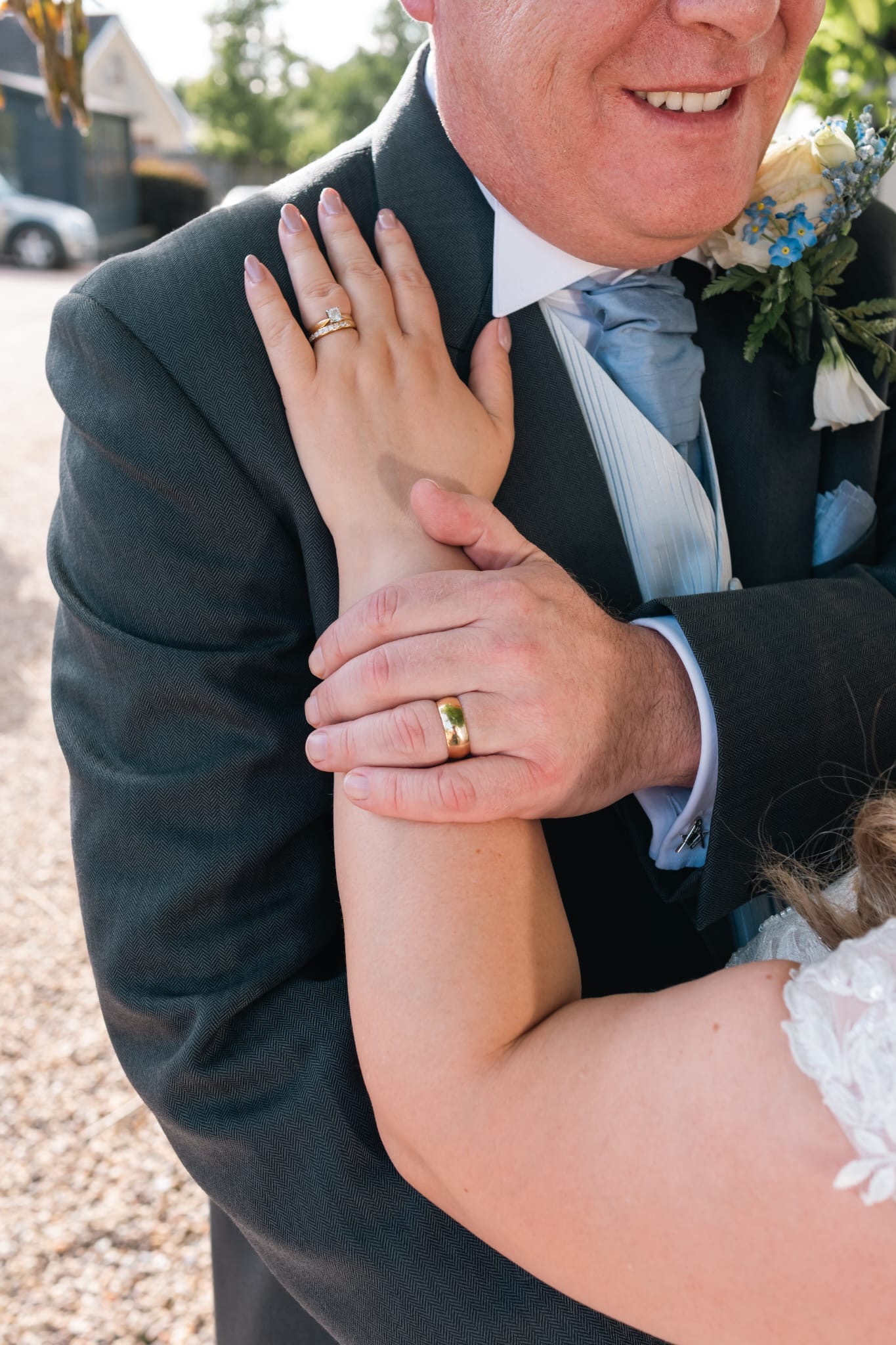 HANDS WITH WEDDING RINGS ON