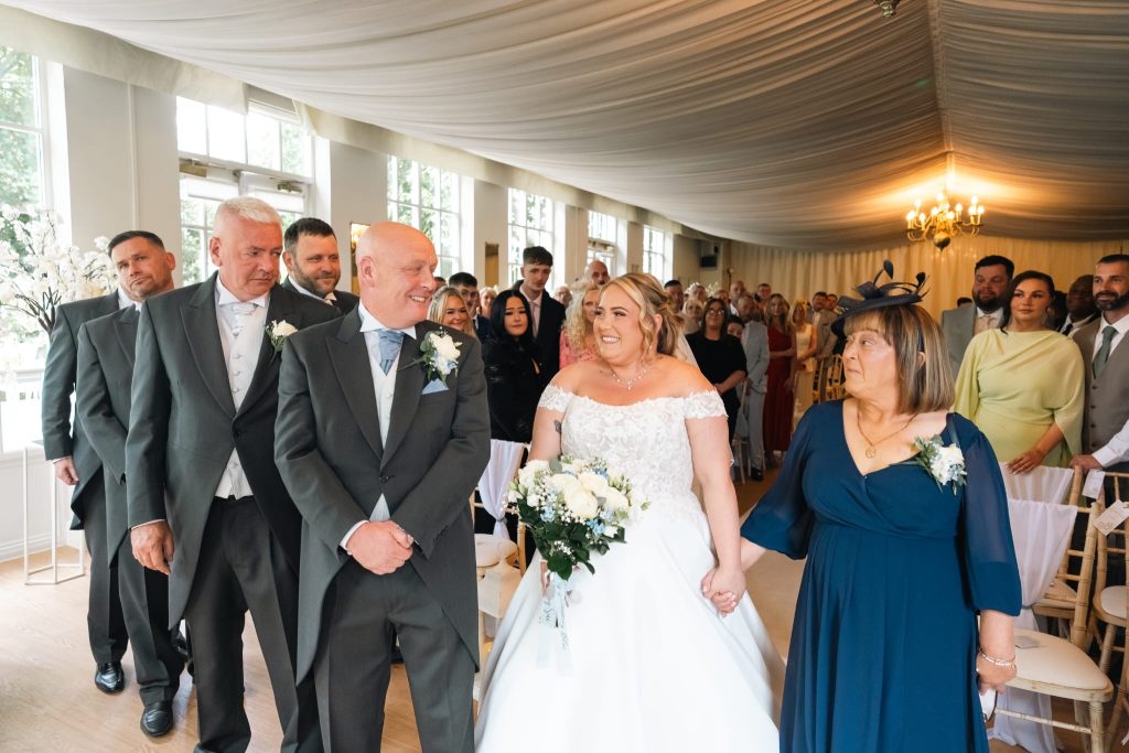 BRIDE AND GROOM AT ALTER
