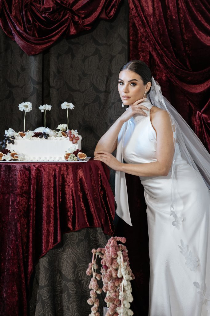 backdrop fresh flowers, table draping and cake